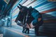 A woman crouching down on the ground in a subway station.